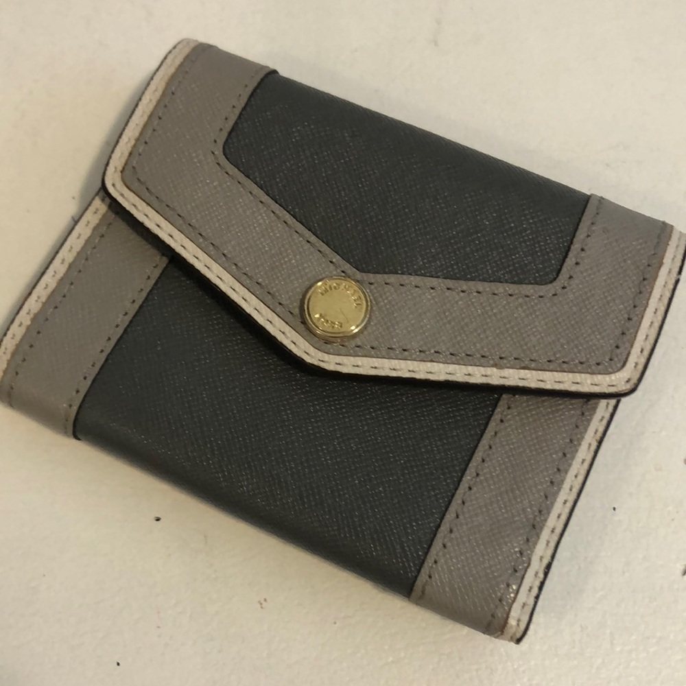 Michael kohrs grey fold up wallet. Snap closure. Great condition!